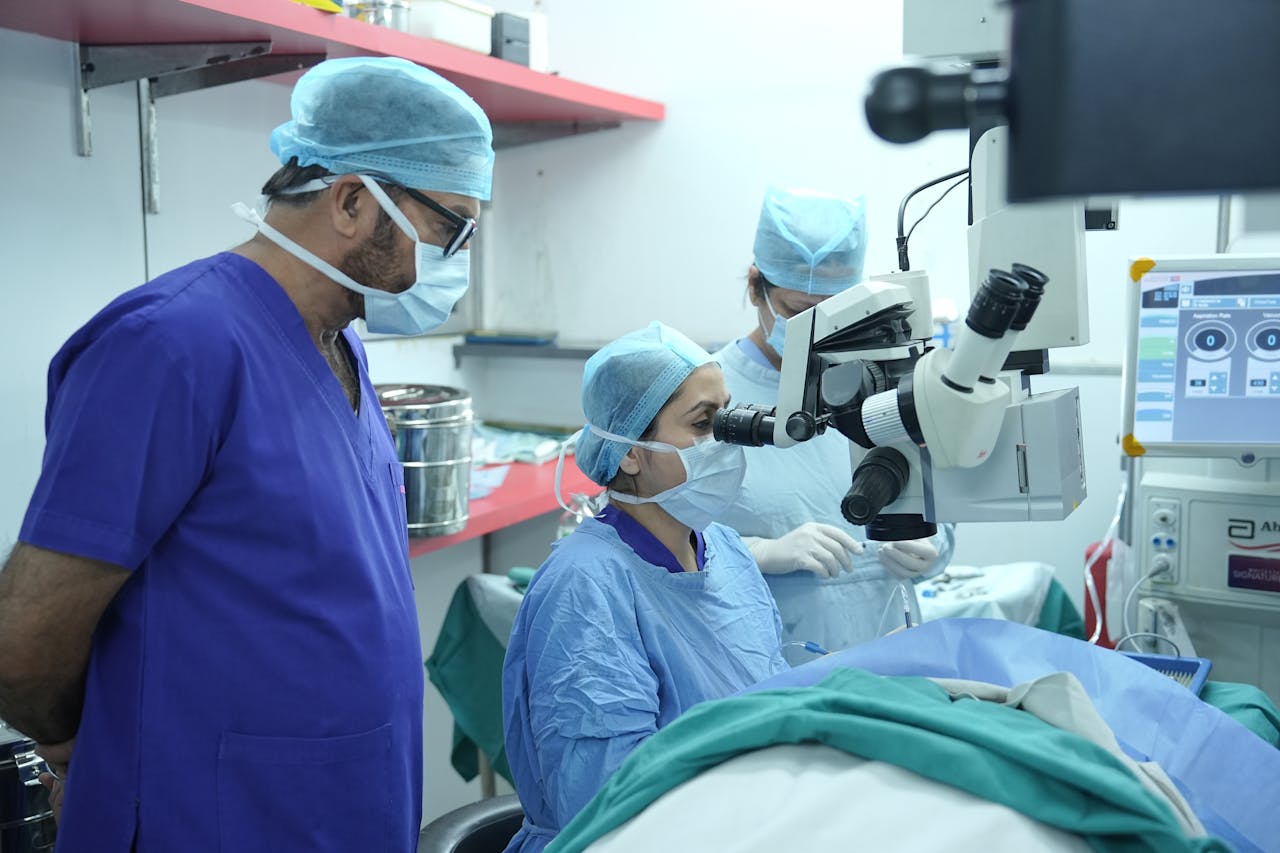 Surgeons performing eye surgery in a New Delhi hospital operating room.